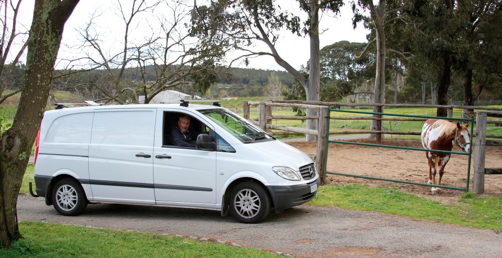 The Australian farrier Phillip Smailes in his van